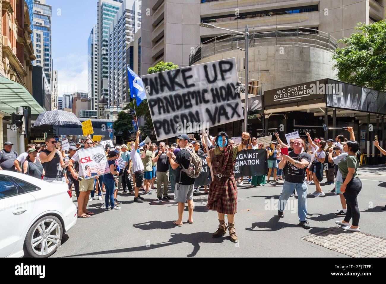 Sydney, Australia. 20 Feb 2021. The 'Millions March' anti-vaxx (anti compulsory COVID-19 coronavirus vaccinations) protest in Hyde Park and through the streets of Sydney's city centre. Event organizers anticipated a crowd of 1500 to 2000, but turnout on the day was far in excess of the expected crowd size and is likely to have numbered well over 3000. During the protest march, traffic was brought to a standstill at the intersection of King and Castlereagh Streets due to the large numbers of people involved. Pictured: traffic brought to a standstill by the street march protest at the intersecti Stock Photo