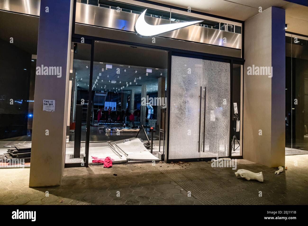 The Nike store on Passeig de Gràcia is seen looted during the  demonstration. Fifth night of protests and riots in response to the arrest  and imprisonment of rapper Pablo Hasel accused of