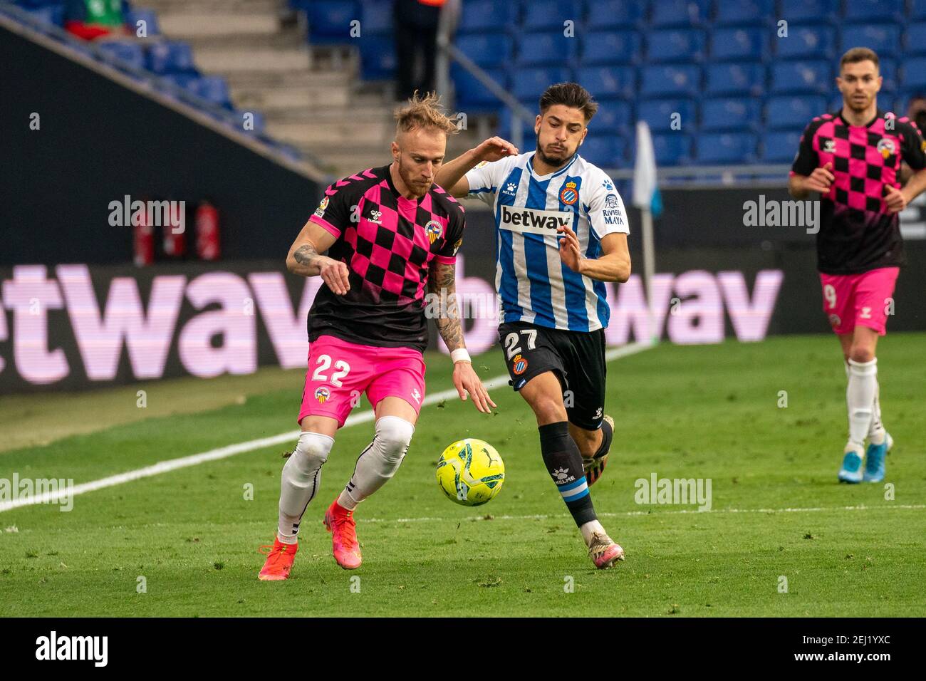 Cornella, Spain. 20th Feb, 2021. Espanyol's Oscar Gil (R) vies with Sabadell's Pierre Cornud during the Spanish second division league match between RCD Espanyol and CE Sabadell in Cornella, Spain, on Feb. 20, 2021. Credit: Joan Gosa/Xinhua/Alamy Live News Stock Photo