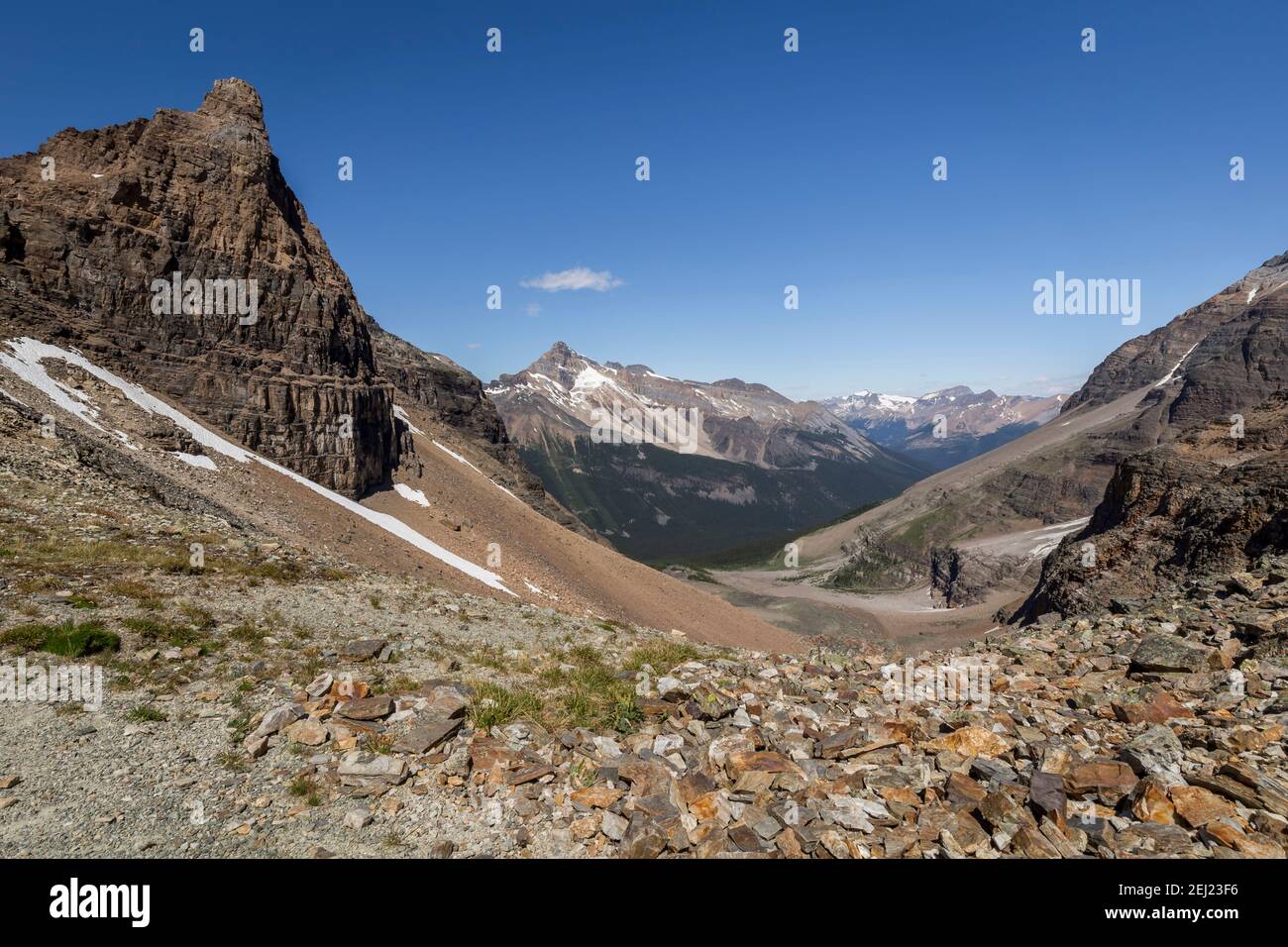 Canadian Rockies landscape of a mountain range from Wiwaxy Gap during a summer sunny day with a blue sky, Alpine Circuit, Lake O'Hara, Canada Stock Photo