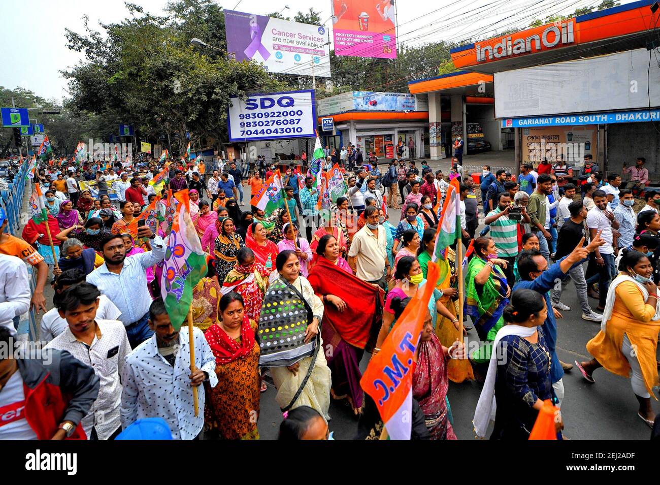 Protestors marching during the demonstration.All India Trinamool Congress protest against the regular price hike on Petrol & Diesel in front of an Indian Oil Petrol Pump. Stock Photo
