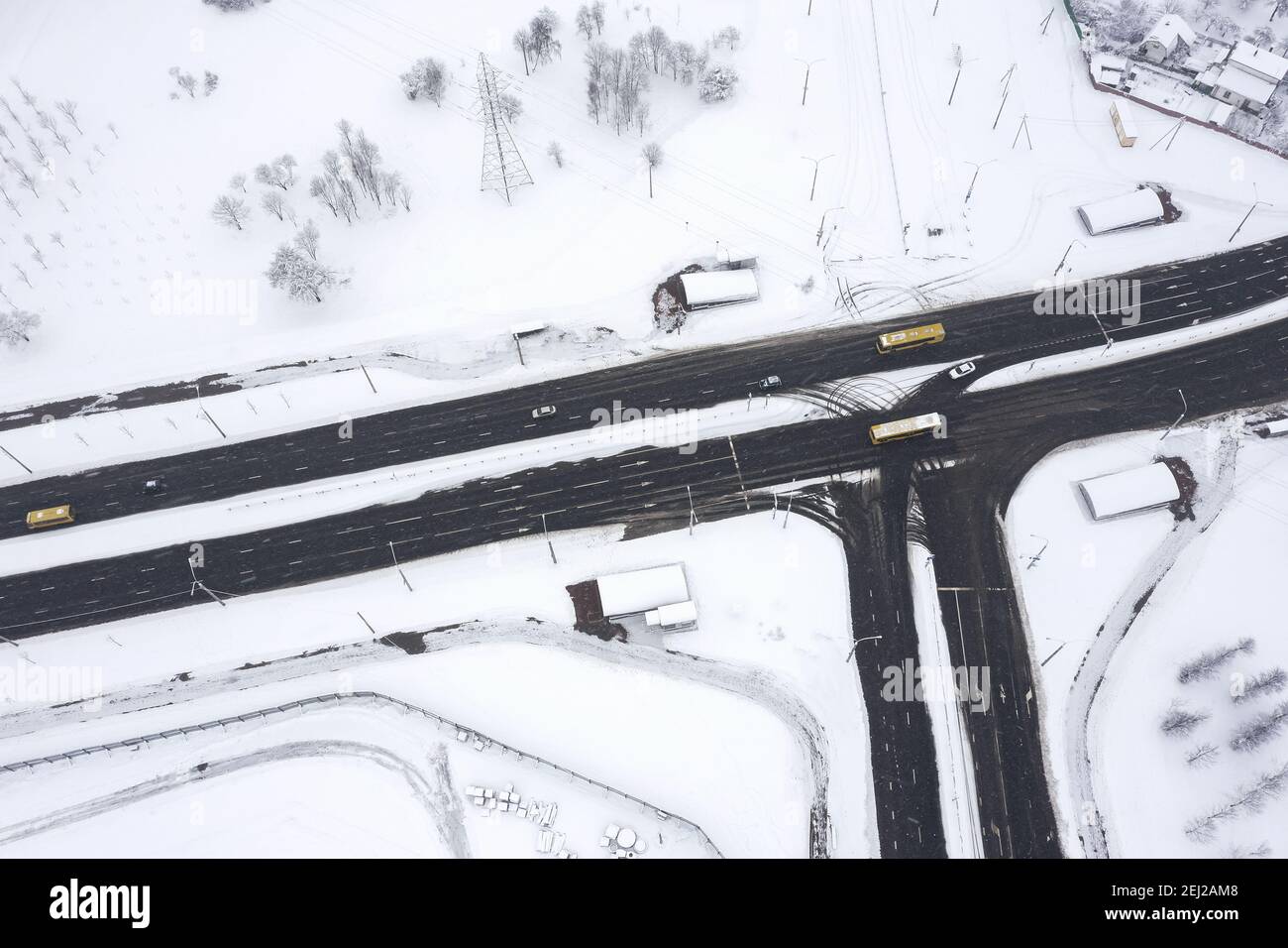 aerial view of highway intersection with low traffic on snowy winter day Stock Photo