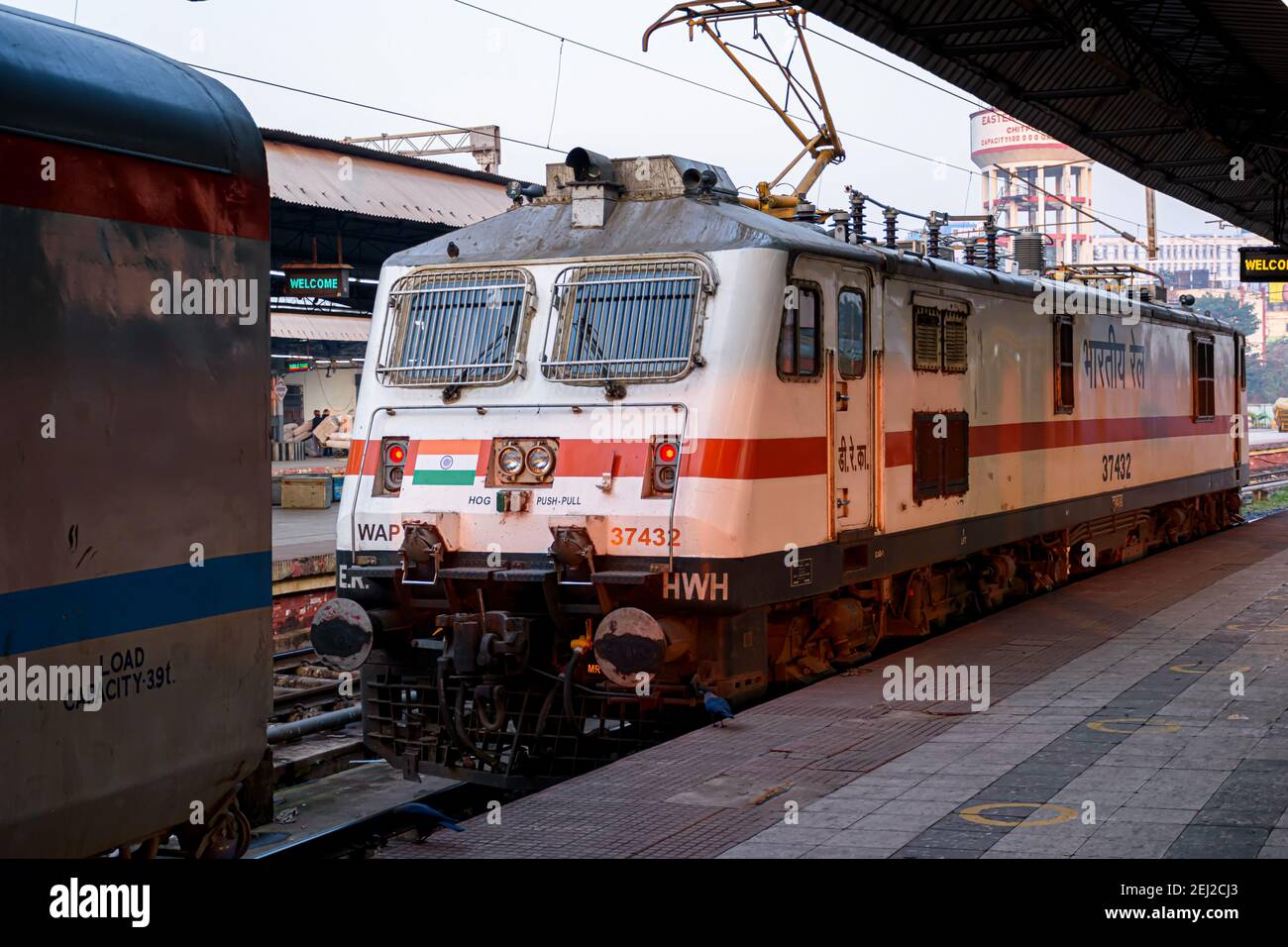 Picture of a locomotive engine is wating for connecting with a passenger train at a Junction Railway Station of Indian Railways system. Kolkata, India Stock Photo