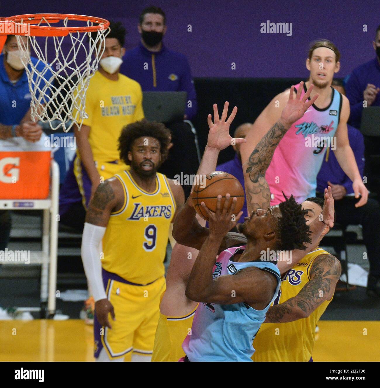 Los Angeles, United States. 20th Feb, 2021. Miami Heat guard Jimmy Butler scores over Los Angeles Lakers' forward Kyle Kuzma during the second half at Staples Center in Los Angeles on Saturday, February 20, 2021. The Heat defeated the Lakers 96-94. Photo by Jim Ruymen/UPI Credit: UPI/Alamy Live News Stock Photo