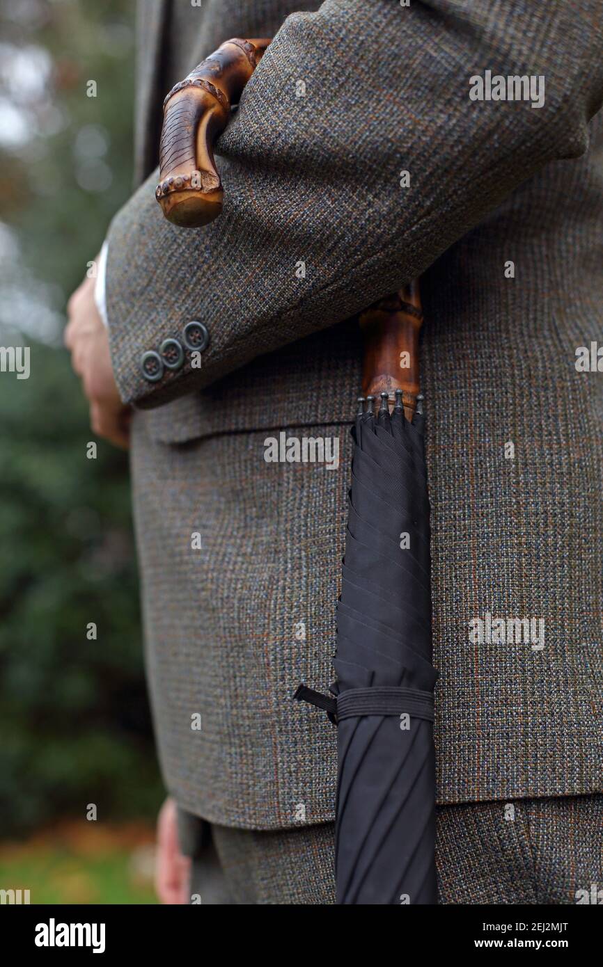 British gentleman with Bamboo handle umbrella outside Stock Photo - Alamy