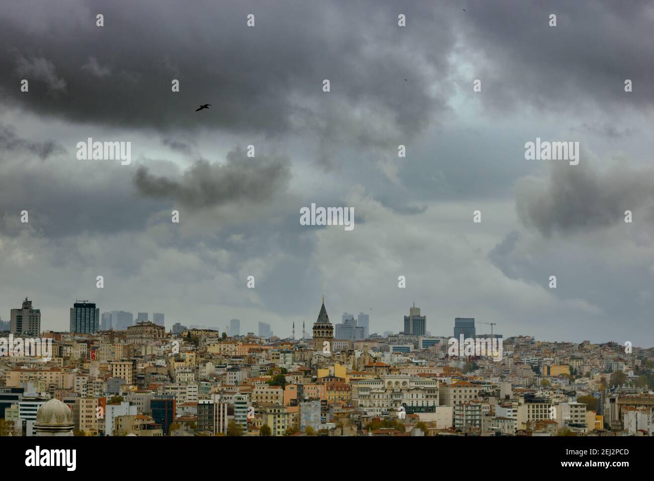 Cityscape of Istanbul with Galata Tower at cloudy sky. suleymaniye landscape. Dramatic clouds and Istanbul. Istanbul background photo. Travel to Istan Stock Photo