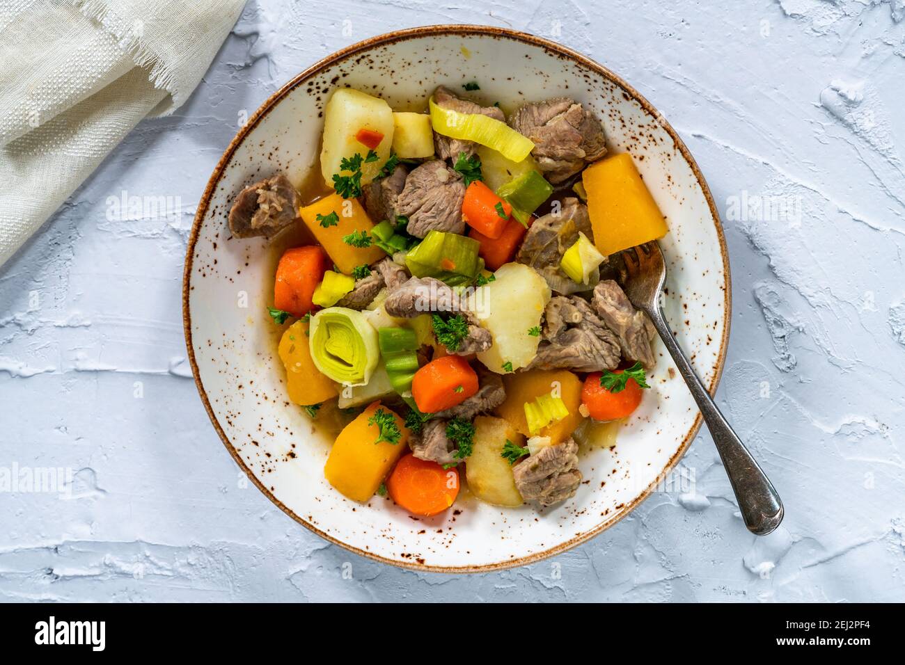 Cawl -  traditional hearty Welsh stew made of lamb with leeks, potatoes, swedes and carrots Stock Photo