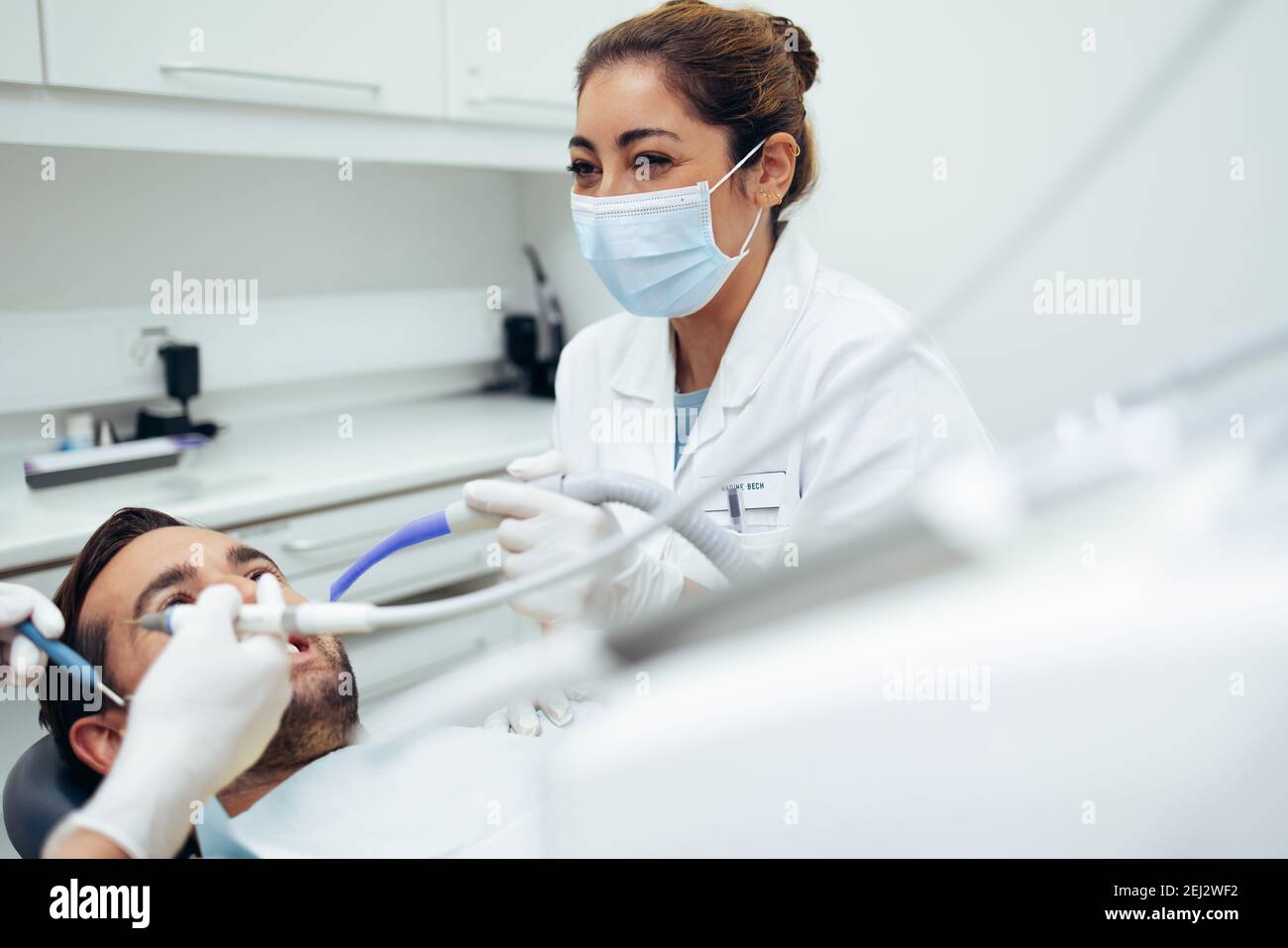Doctors checking patients wearing mask hires stock photography and