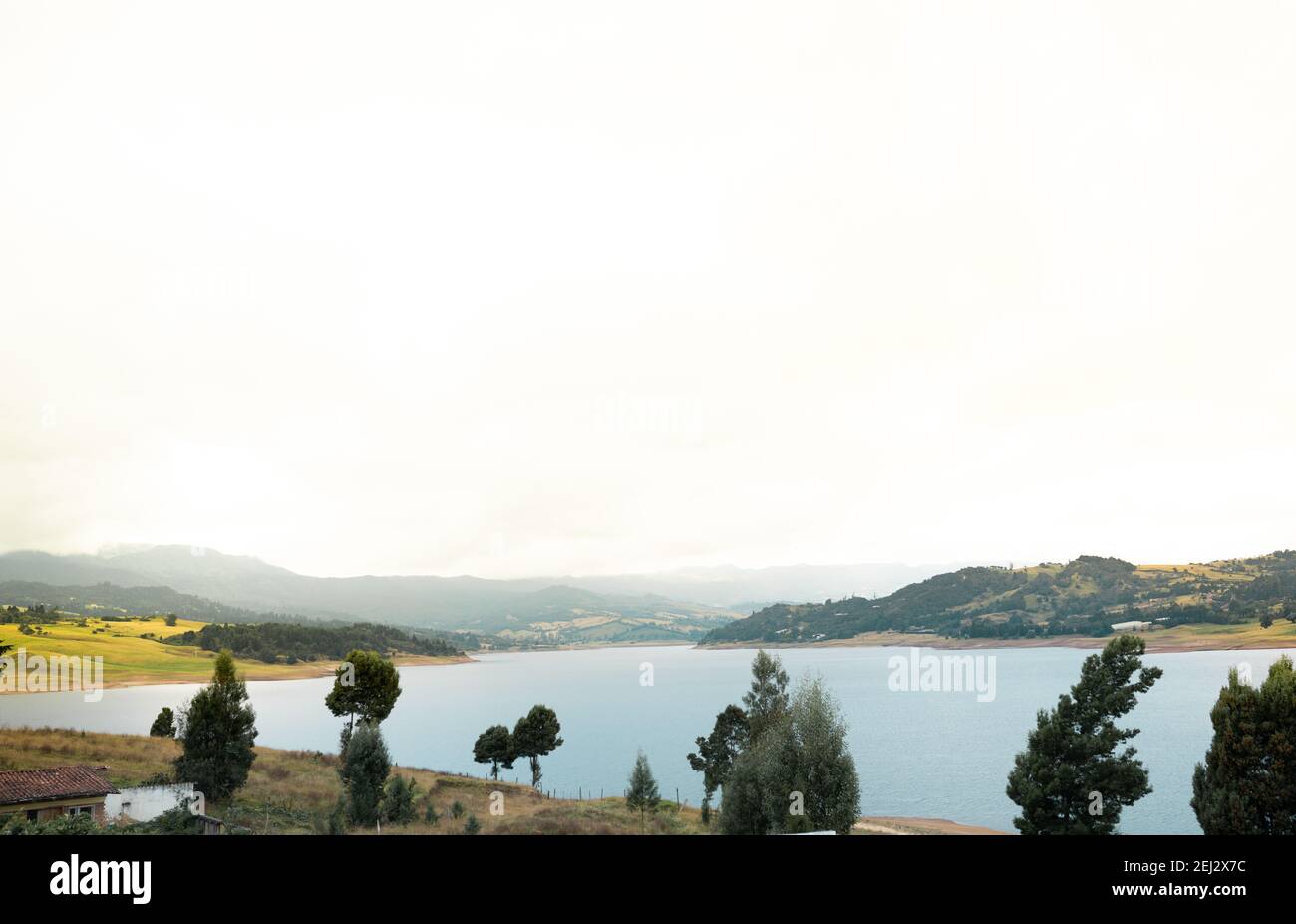 A mesmerizing view of a calm lake under a cloudy sky Stock Photo - Alamy