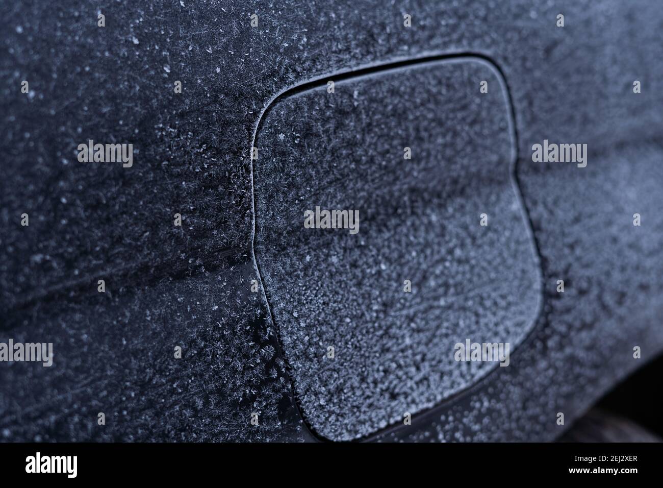 Frozen car gas tank flap in winter, closeup Stock Photo Alamy
