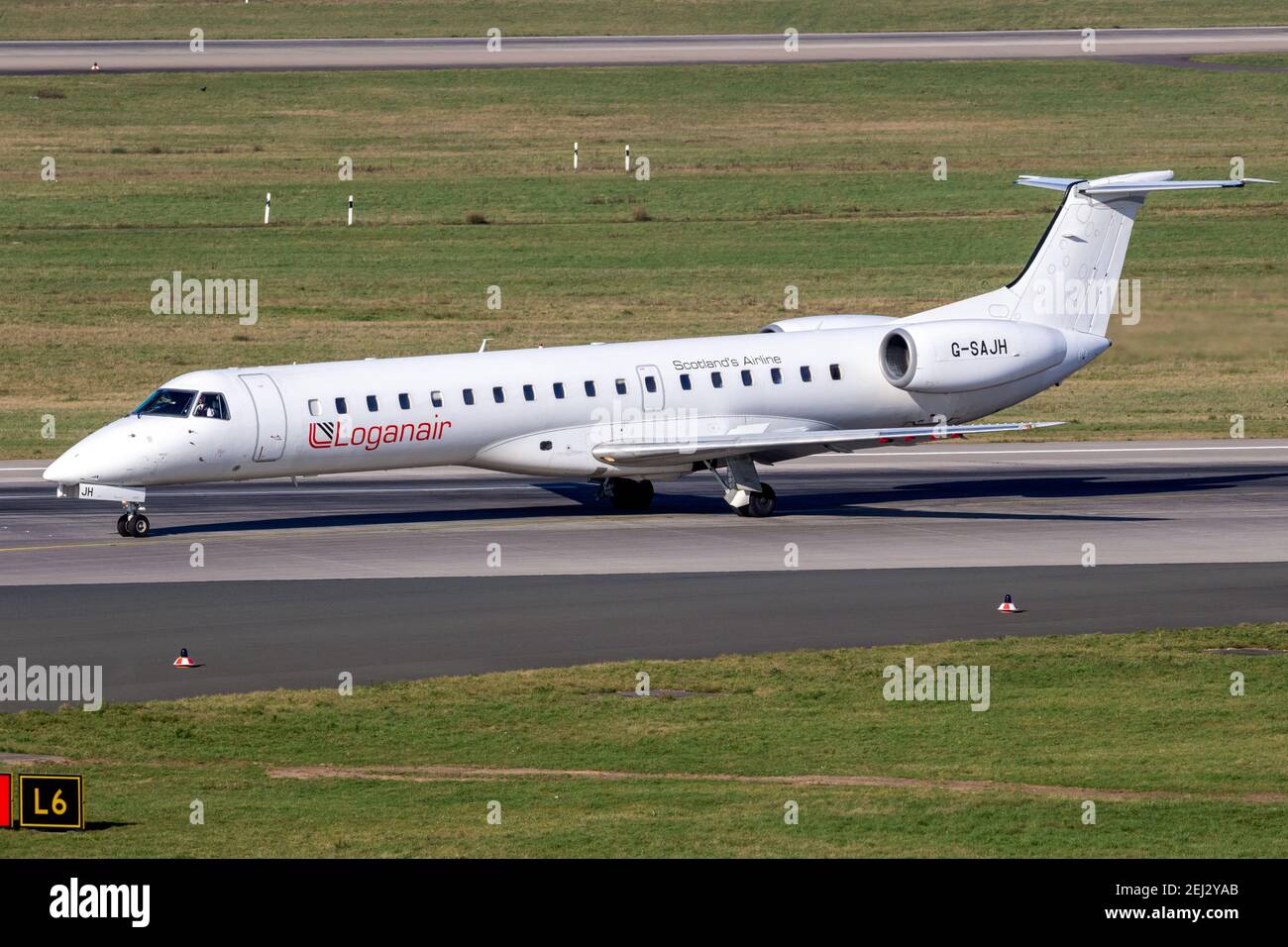 Loganair Embraer ERJ-145EP passenger plane arriving at Dusseldorf Airport. Germany - February 7, 2020 Stock Photo
