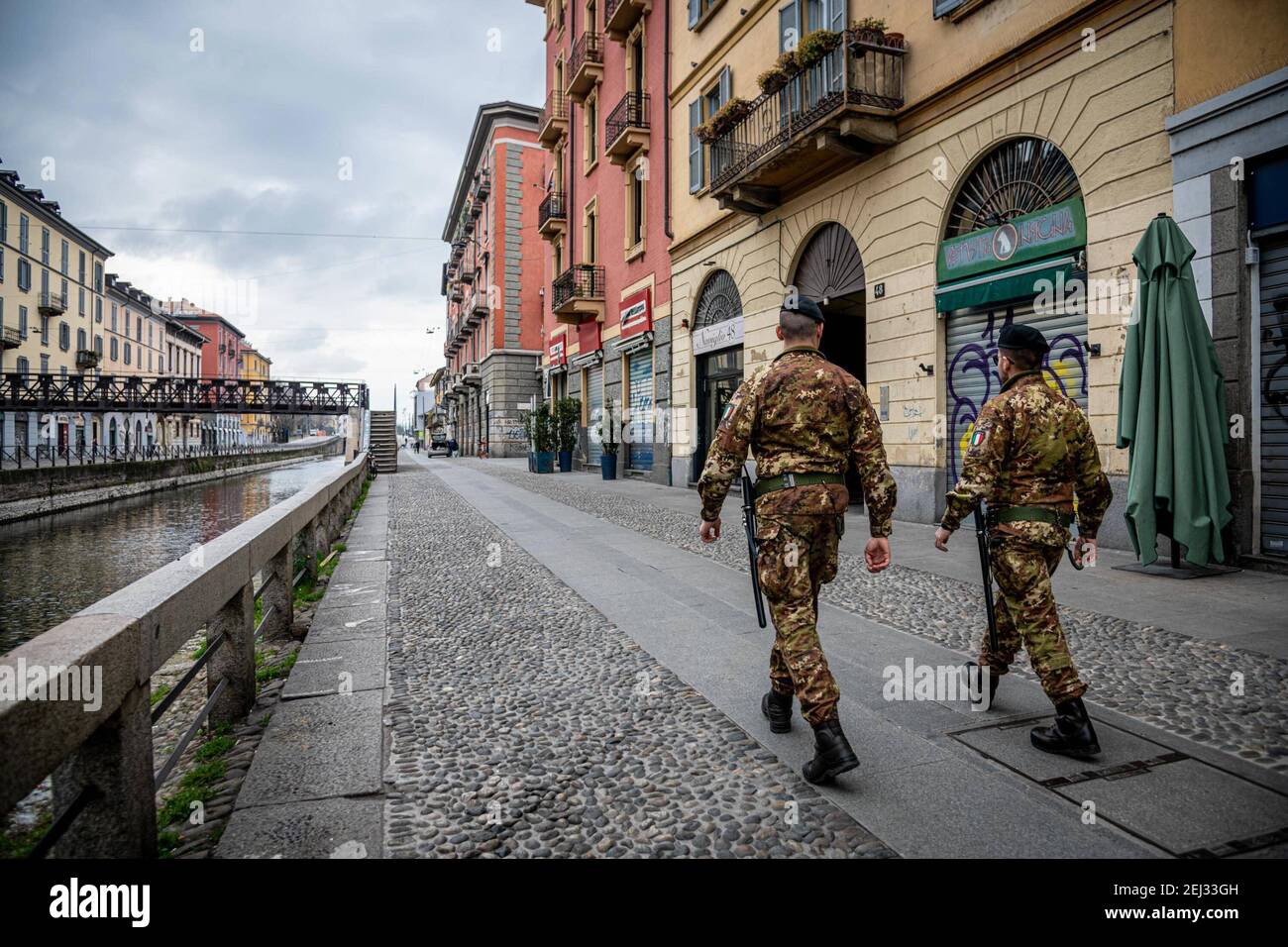 Reportage, Italy. 13th Mar, 2021. 3/13/2021 - Milan - Coronavirus - Lives suspended on the first day of curfew, shops closed and few people on the street along the large canal. soldiers patrol the street (Milan - 2020-03-12, Marco Passaro) ps the photo can be used in compliance with the context in which it was taken, and without the defamatory intent of the decorum of the people represented Editorial Usage Only (Photo by IPA/Sipa USA) Credit: Sipa USA/Alamy Live News Stock Photo