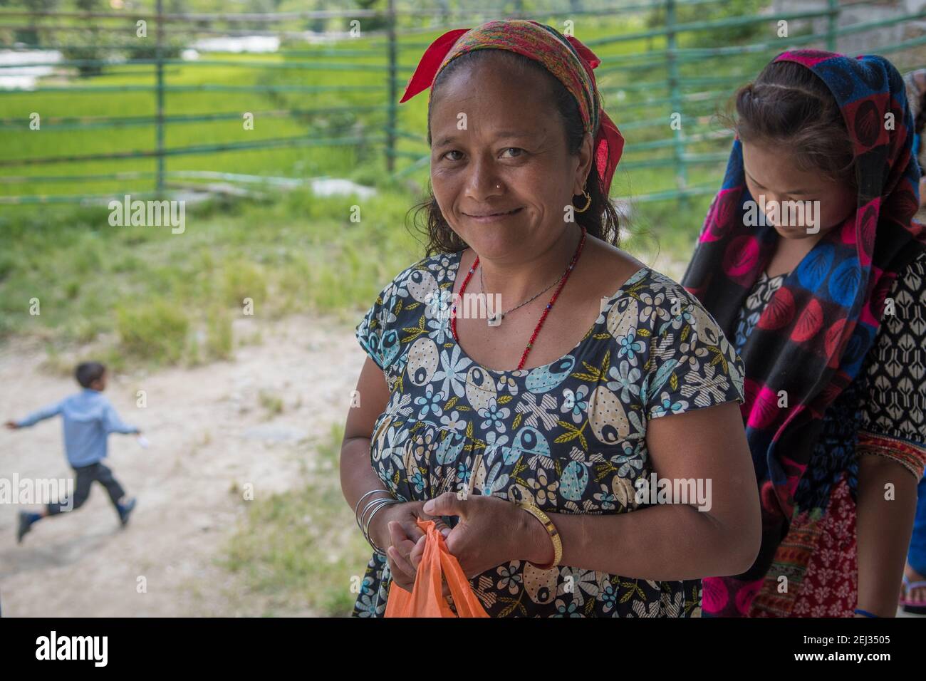 Pokhara, Nepal. 09-15-2017. Women from a village in the mountains of Nepal bringing food for their children for lunch when attending school. Stock Photo