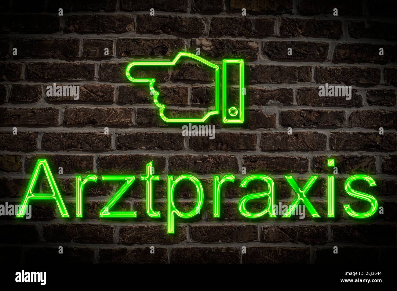 Detail photo of a neon sign on a wall with the inscription Arztpraxis Stock Photo