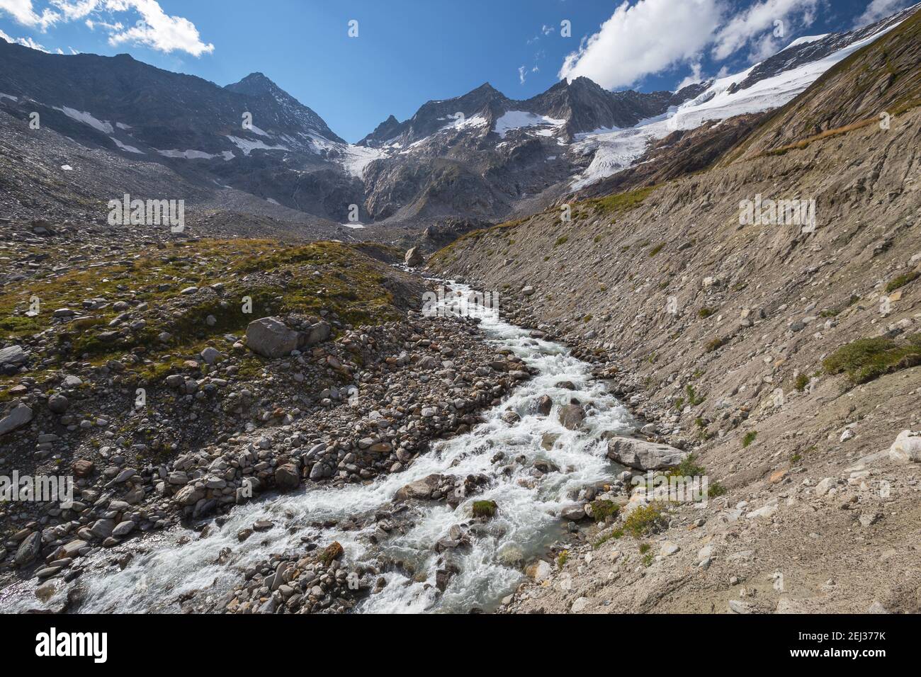 Alpine torrent on the moraine. Melting water of Simony glacier. Maurer valley (Maurertal). Venediger group. Virgental. Austrian Alps. Europe Stock Photo