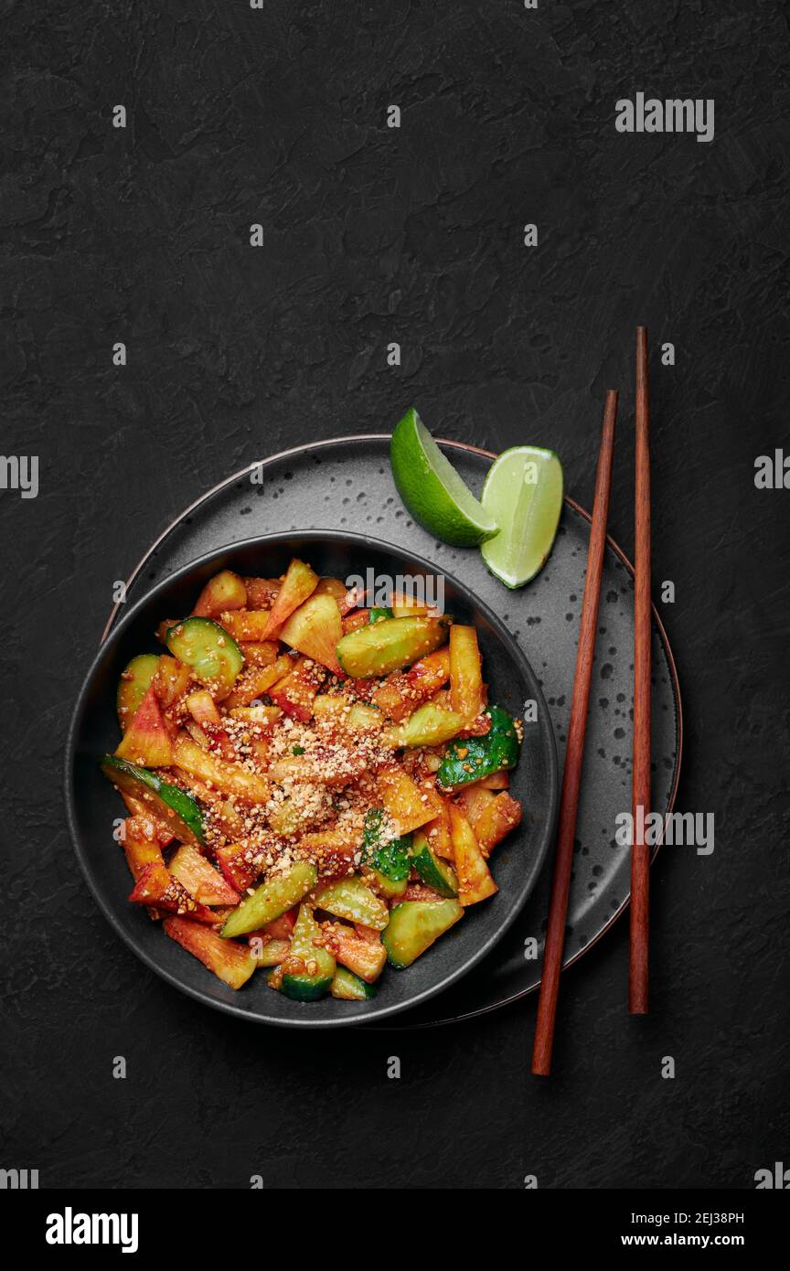 Penang Rojak in black bowl on dark slate table top. Malaysian or