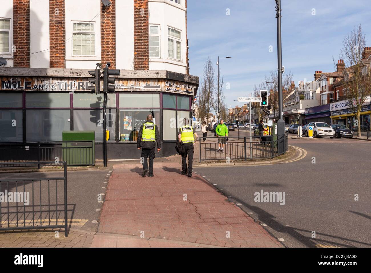 Compliance ambassadors in Hamlet Court Road, Westcliff on Sea, Essex, UK, during COVID 19 lockdown. Closed restaurant on junction Canewdon Road Stock Photo