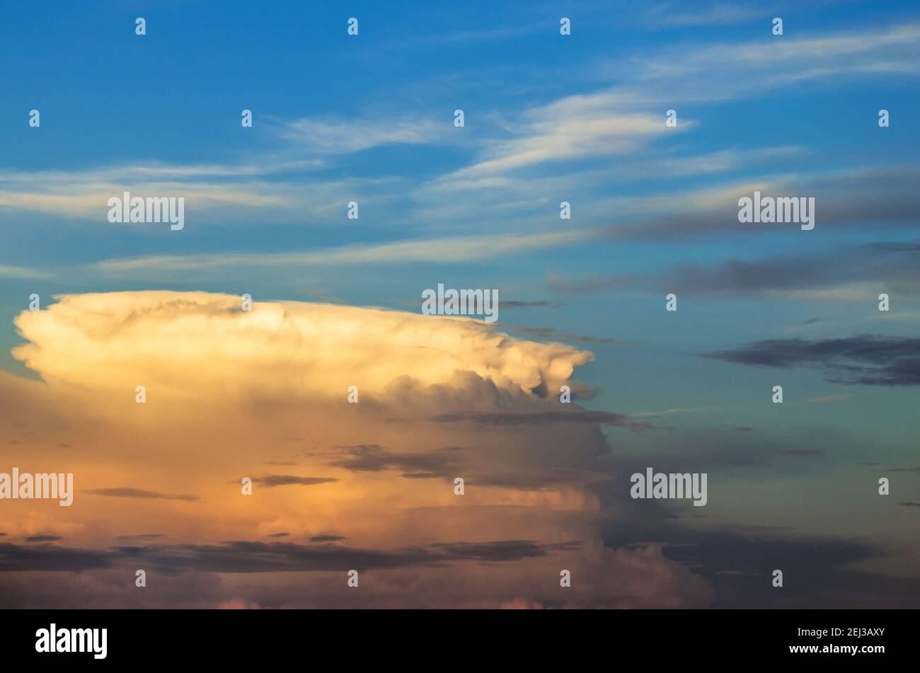 Supercell thunderstorm sunset and the blue sky and cirrus clouds Stock Photo