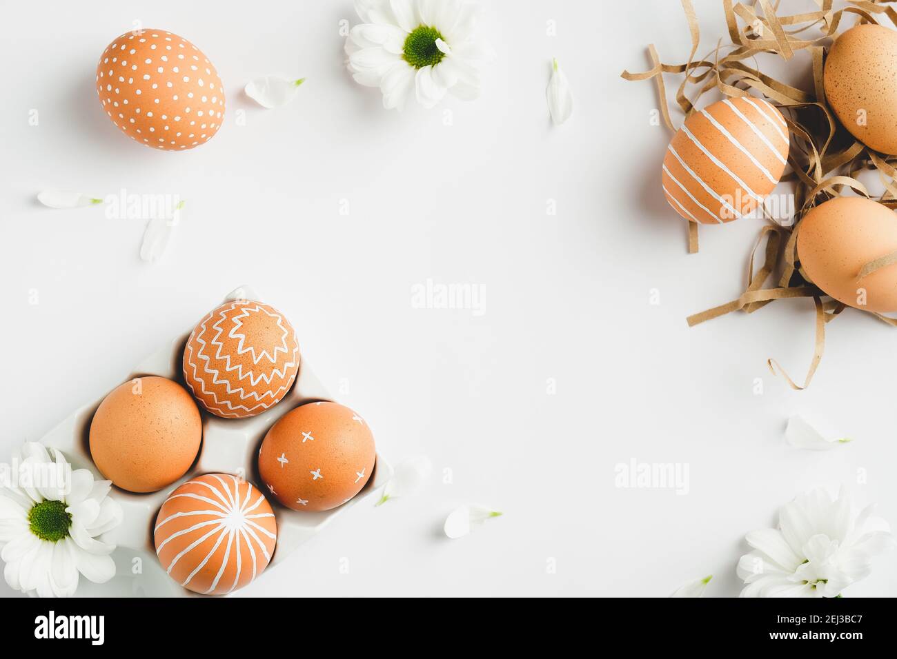 Easter flat lay composition. Easter eggs and spring flowers on white ...