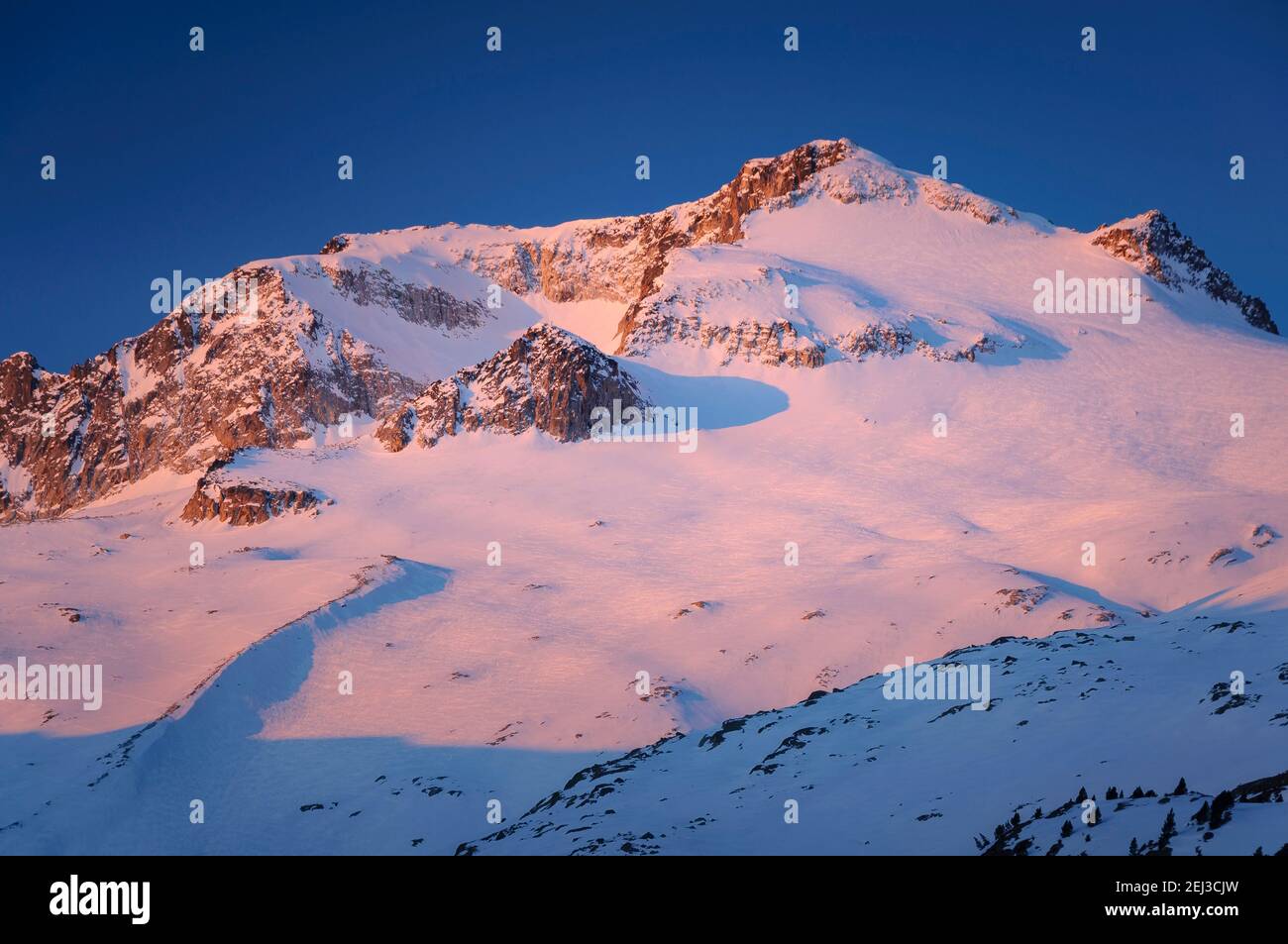Winter sunrise in the Aneto summit and Maladetas massif, seen from Plan d'Aigualluts (Benasque valley, Pyrenees, Spain) Stock Photo