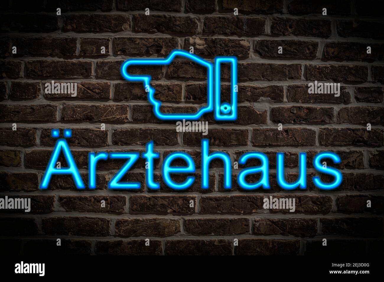 Detail photo of a neon sign on a wall with the inscription Ärztehaus Stock Photo