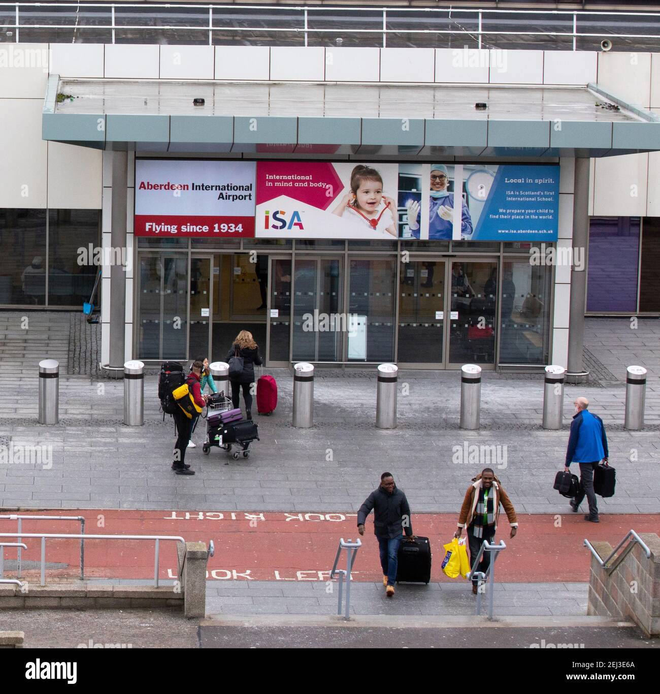 Passengers outside the entrance to the terminal building at Aberdeen International Airport, Scotland Stock Photo