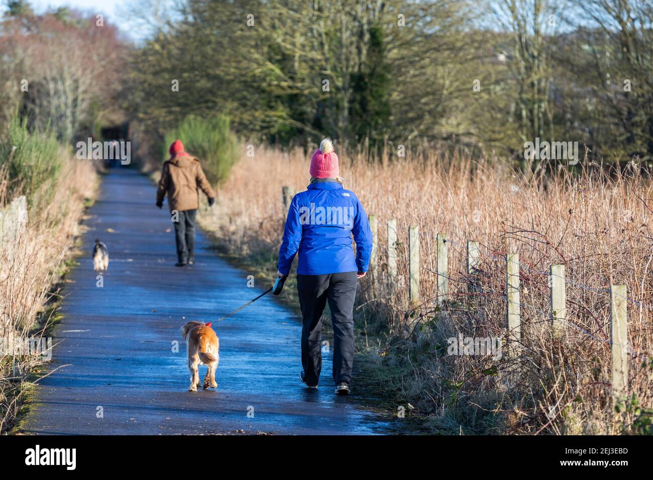 Walkers on the old railway line path at Dyce in the city of Aberdeen, Scotland Stock Photo