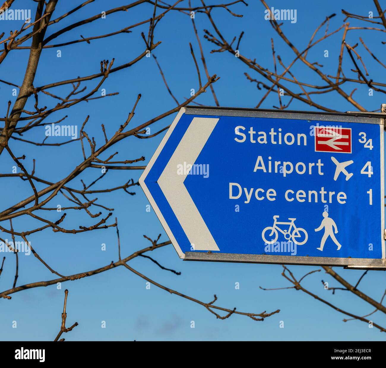 Sign in Dyce showing directions to Dyce railway station and the airport, as well as other ameneties in the city of Aberdeen, Scotland Stock Photo