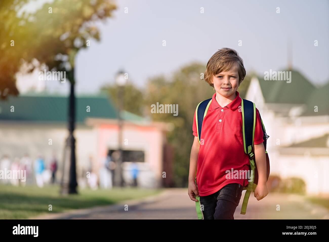 The schoolboy returns from school in a good mood Stock Photo