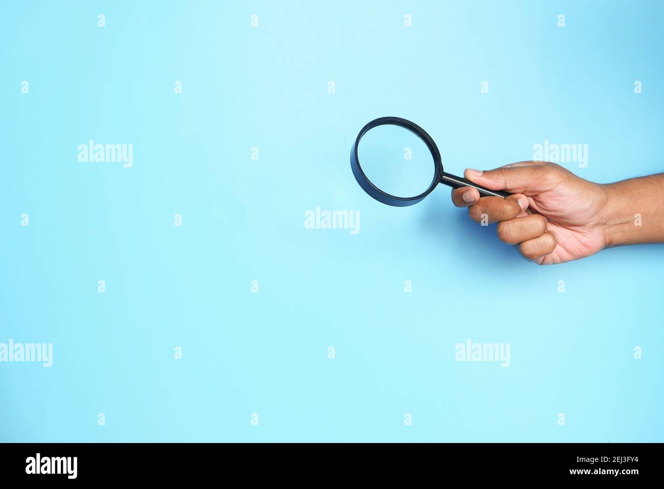 Hand holding blue book hi-res stock photography and images - Alamy