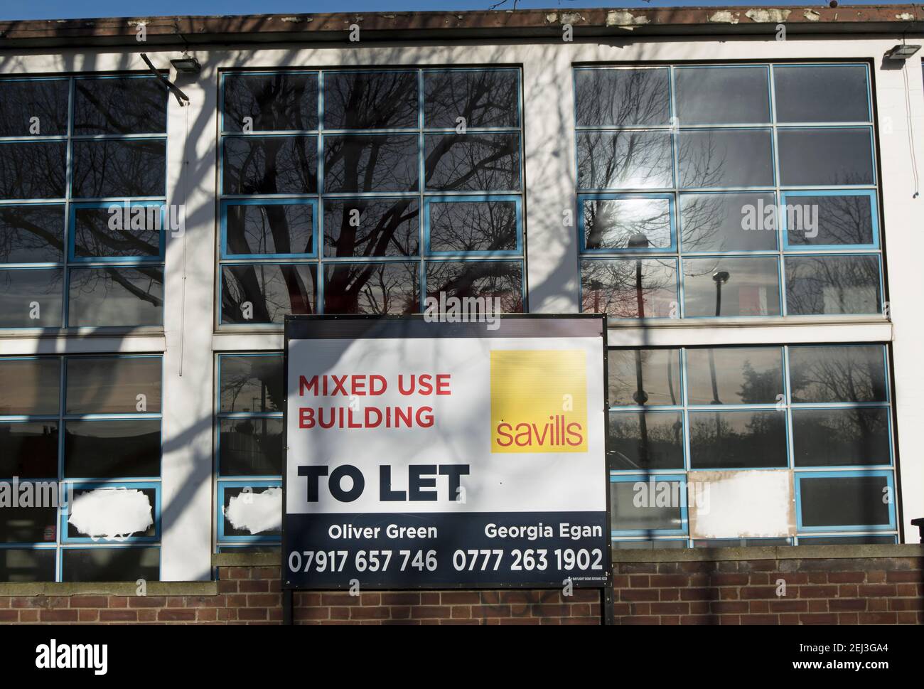 estate agent sign advertising a mixed use building to let, in richmond, london, england Stock Photo