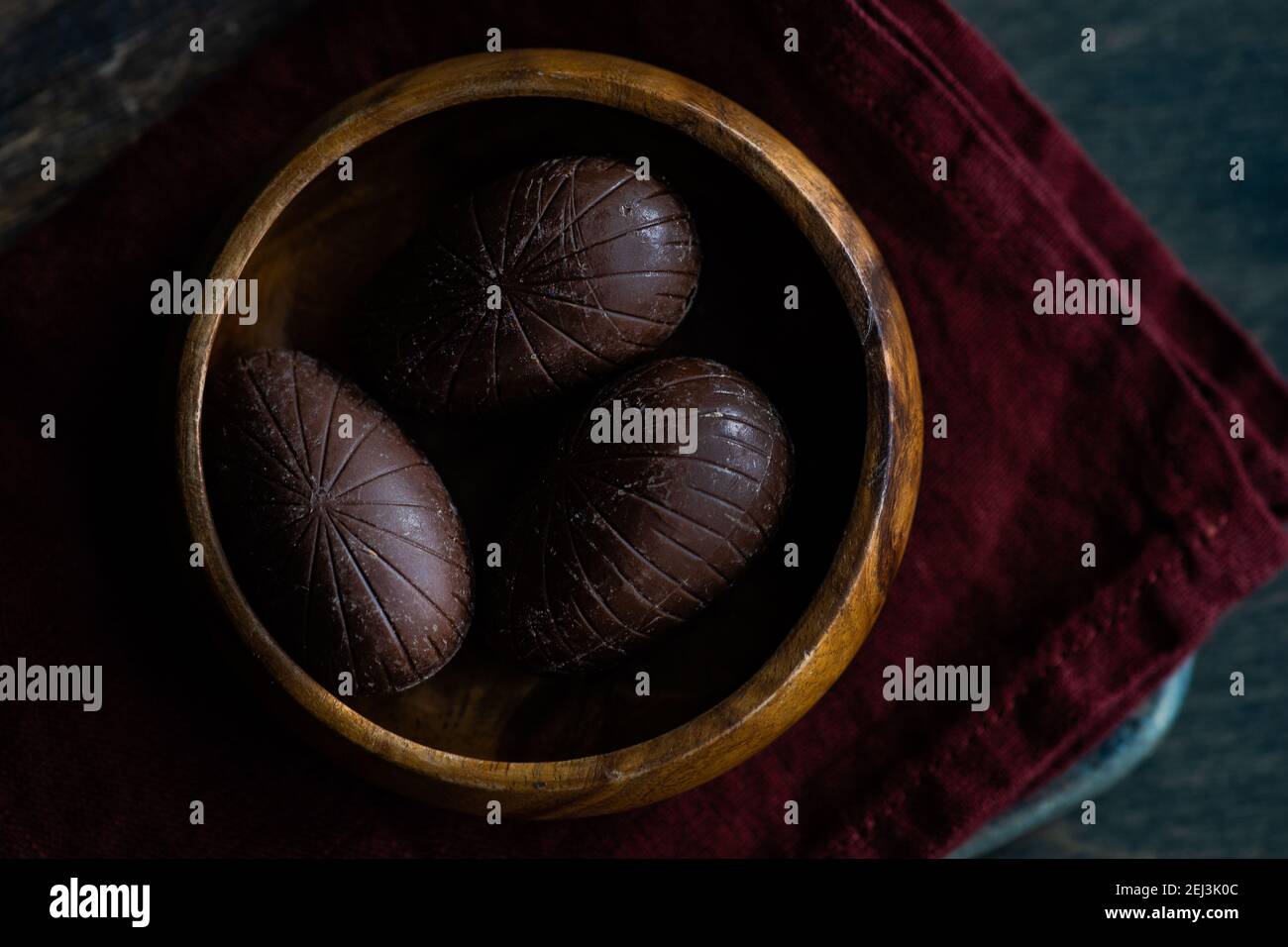Easter place setting with various chocolate eggs in a bowl Stock Photo
