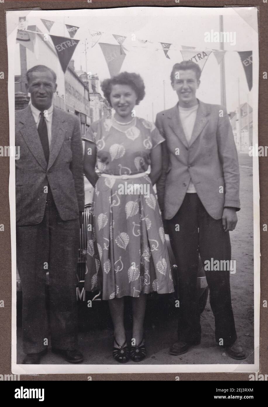 Vintage black and white photo of woman with two men 1950s. Stock Photo
