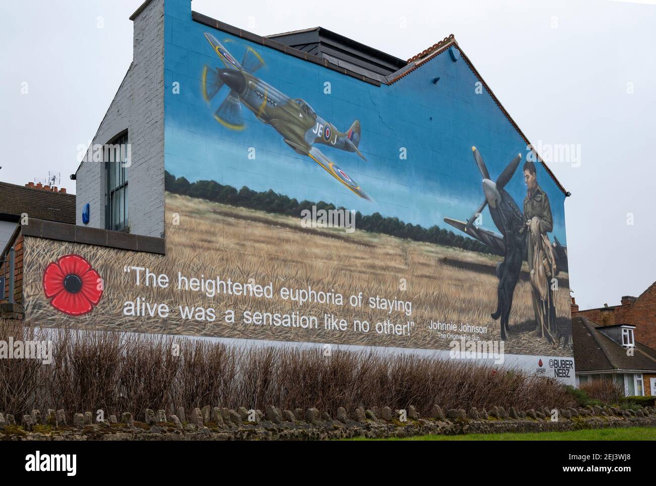 Loughborough, Leicestershire, UK. 21st February 2021.  A mural on the side of a building in Loughborough portrays the legendary Air Vice Marshal James Edgar ‘Johnnie’ Johnson, who was born locally.   The artwork pays tribute to the Second World War RAF Spitfire pilot, better known as Johnnie Johnson, who shot down more enemy aircraft than any other Allied fighter pilot during the war, flying some 700 operational sorties.   Painted by Buber Nebz, the mural is part of The Ladybird Collective, which is behind several artworks appearing in Loughborough.  Credit: Matt Limb/Alamy Live News Stock Photo