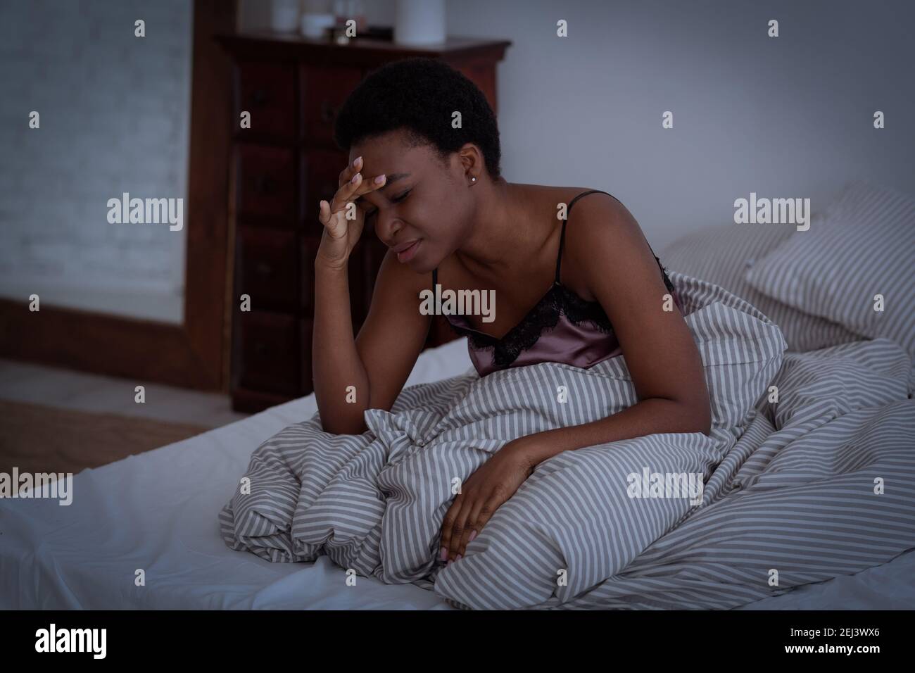Migraine, pain, headache, loud neighbors, trouble sleeping and sad thoughts Stock Photo