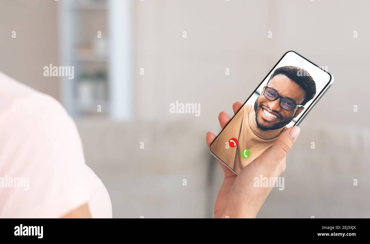 Unrecognizable woman using cellphone for remote communication, talking to her boyfriend online, panorama Stock Photo