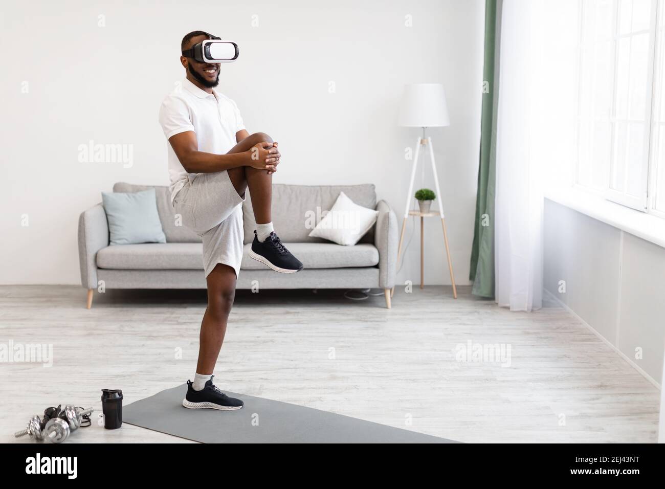 Black Guy Training Wearing Virtual Reality Headset Having Workout