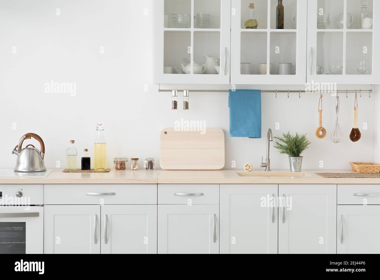 Minimal cozy scandinavian interior after repair. White kitchen furniture,  refrigerator in simple dining room, panorama Stock Photo - Alamy