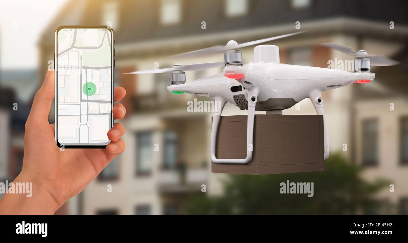 Hand with phone on background of delivery drone. On the screen a map with a location marker. Stock Photo