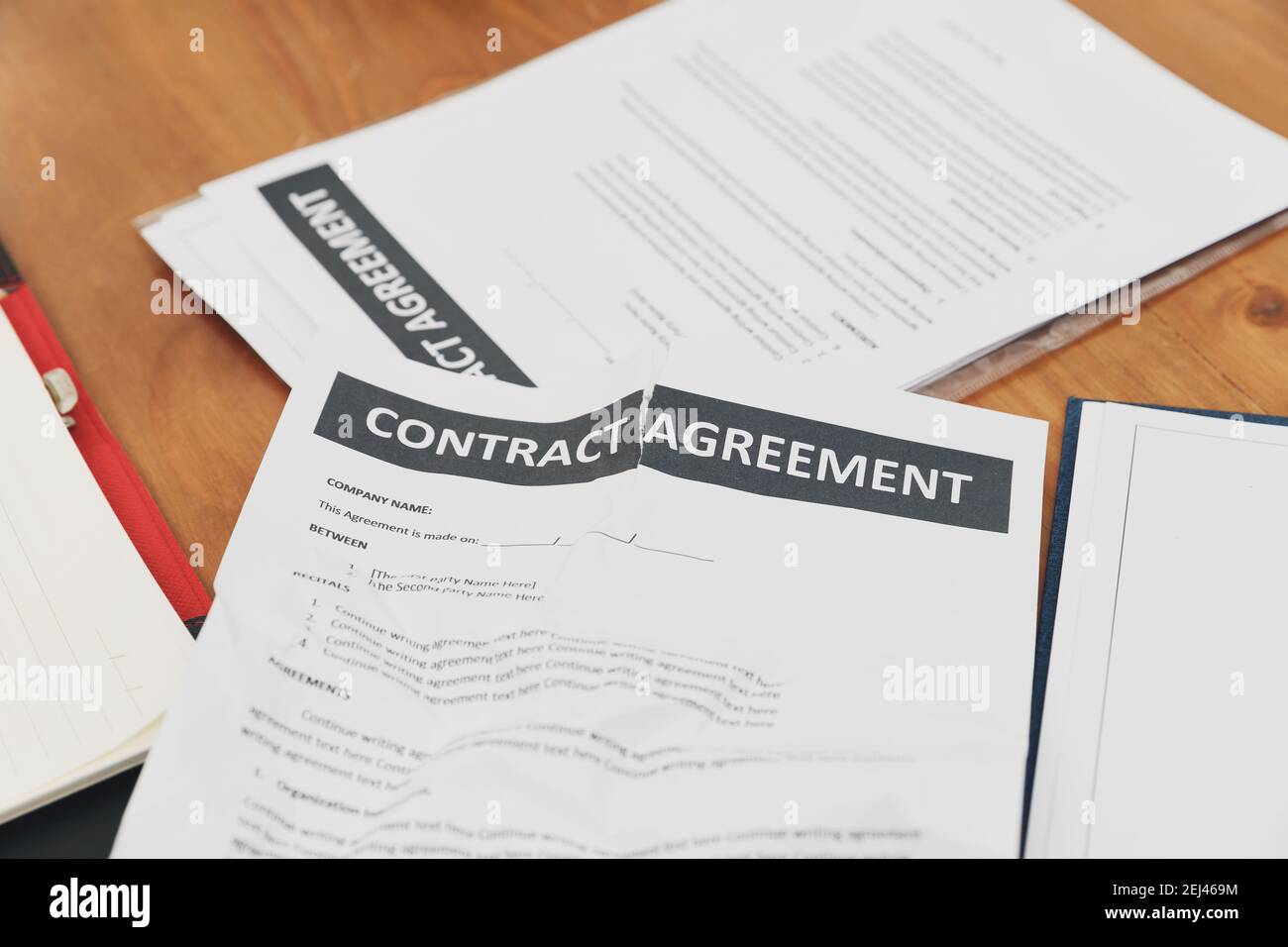 The torn contract paper placed on the table after negotiation fails