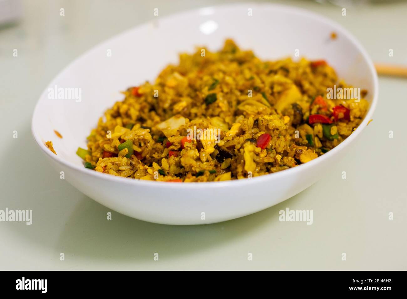 Vegetarian curry fried rice using Omipork ground plant-based meat. Note there is egg in this dish. Stock Photo