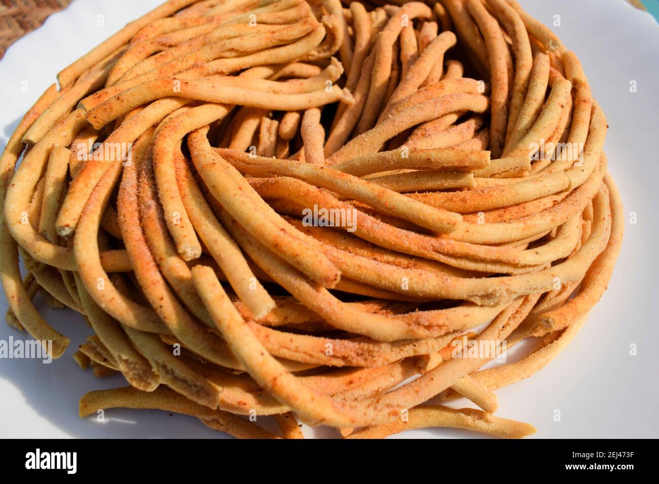 Closeup of Round sev, a tea time delicacy from Asian India.Also known as  Gunchla sev r Gunchala sev served during festival occassions like Diwali ,  ma Stock Photo - Alamy