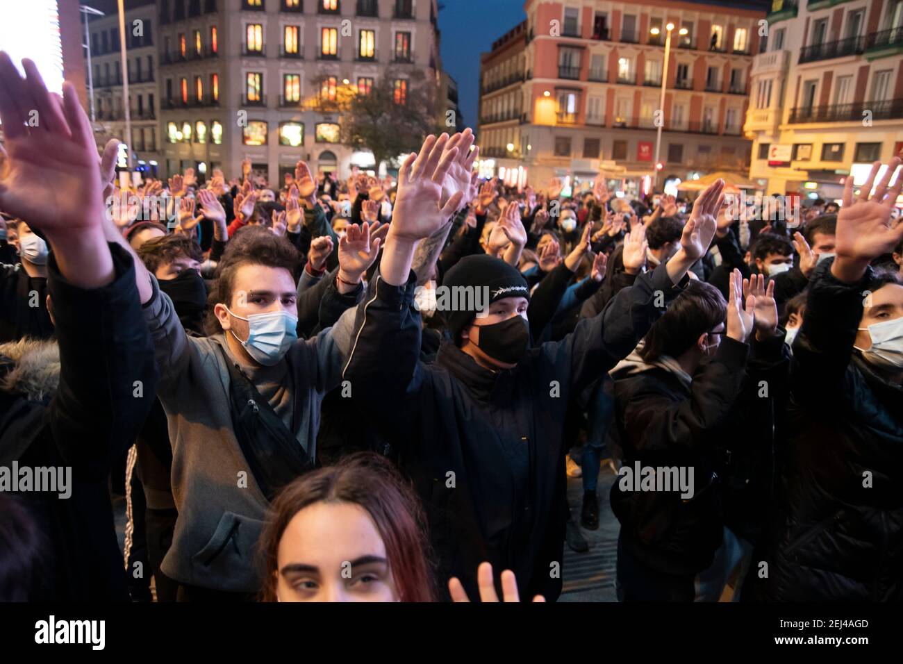 A hundred people have gathered around 7:00 p.m. in the central Plaza de Callao, in Madrid, to demonstrate against the imprisonment of rapper Pablo Hasél. A device of 300 National Police officers have shielded the area to prevent violent altercations.  Thus, they have established a police cordon that separates the Plaza de Callao from Gran Via street, where there are about twenty police vans and dozens of uniformed and plainclothes officers, as well as a helicopter that flies over the area. In addition, the agents carry out searches of some people who enter the square.  With the cry of 'freedom Stock Photo