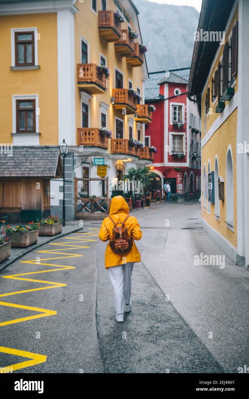Woman in raincoat from behind hi-res stock photography and images - Alamy
