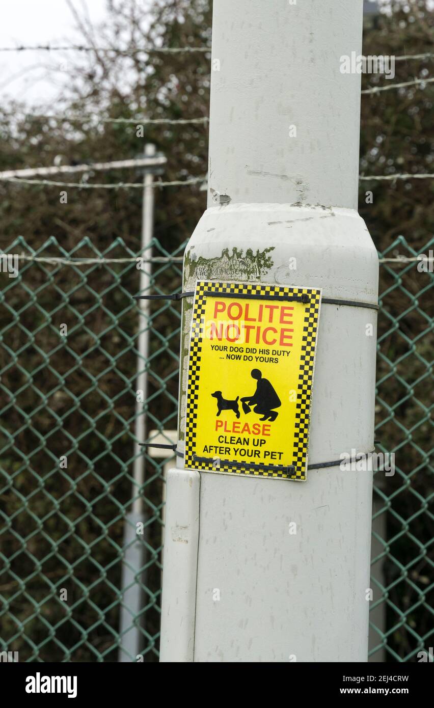 Polite notice clean up after your dog Stock Photo