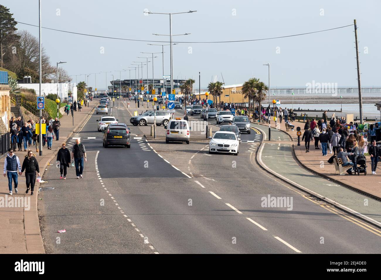 Southend on Sea, Essex, UK. 21st Feb, 2021. The warm and sunny weather has  brought people to the seafront at Southend on Sea despite the COVID 19  lockdown warnings. The seafront car