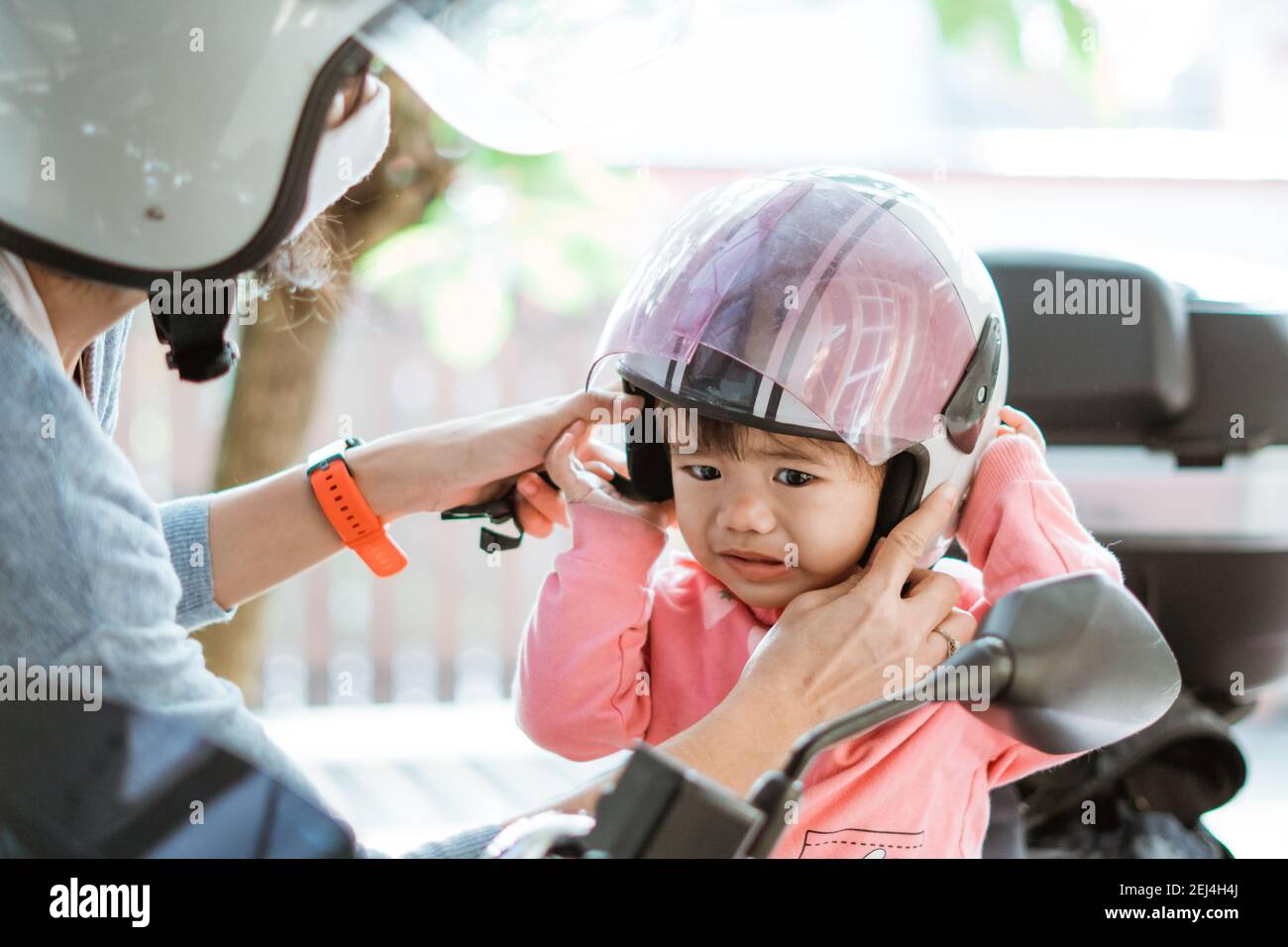 sad babies feel when wearing a helmet with their mother