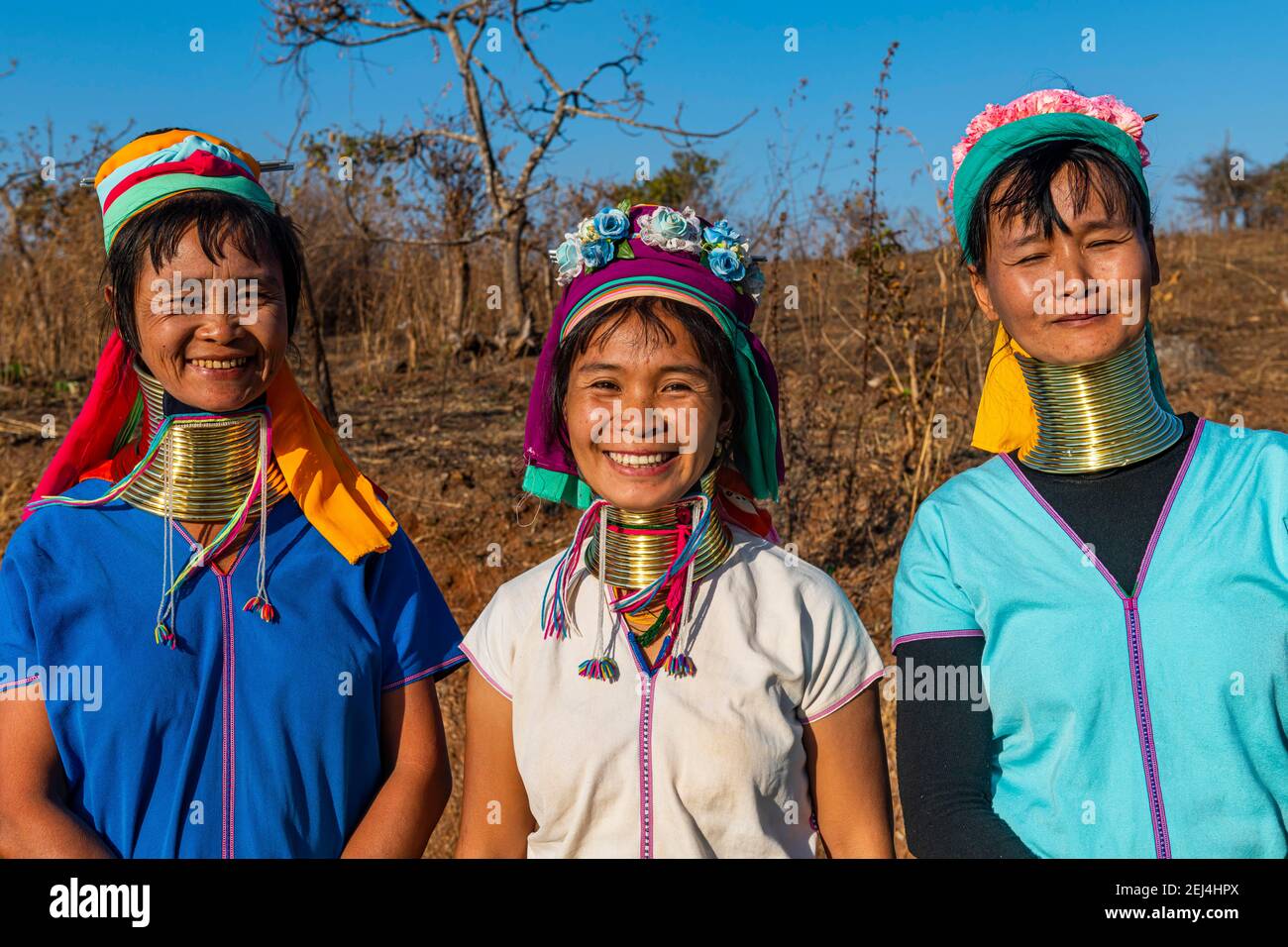 Laughing three Padaung women, Loikaw area, Kayah state, Myanmar Stock Photo