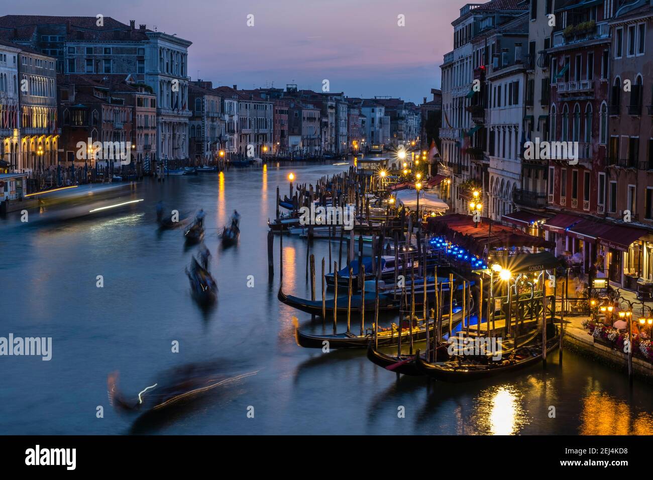 Evening atmosphere at the Rialto Bridge on the Grand Canal, San Marco district, Venice, Veneto region, Italy Stock Photo