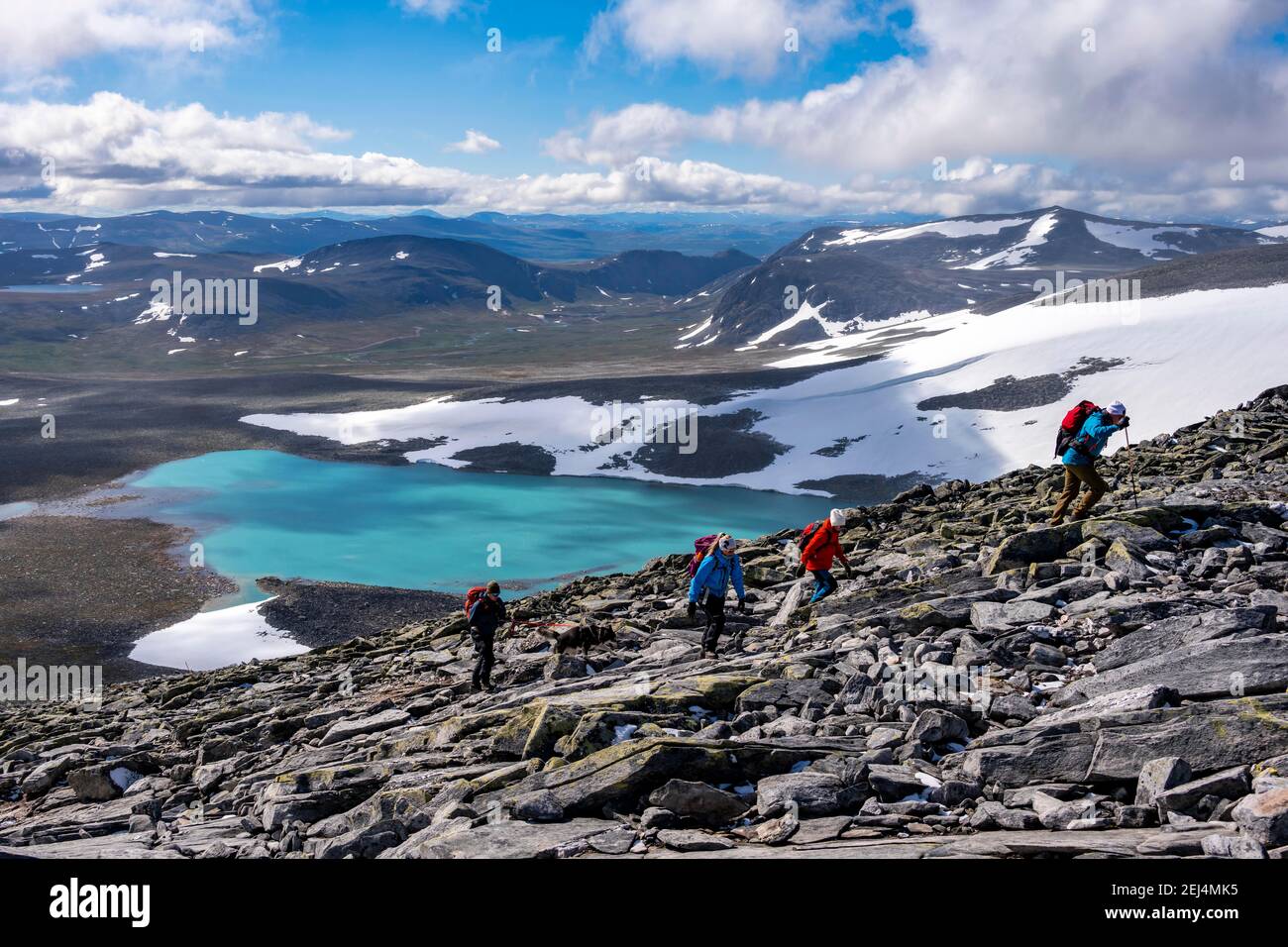 tundra-barren-mountain-landscape-with-mountain-lake-hiker-on-hike
